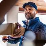 Delivery driver hands a package to a homeowner at the door 